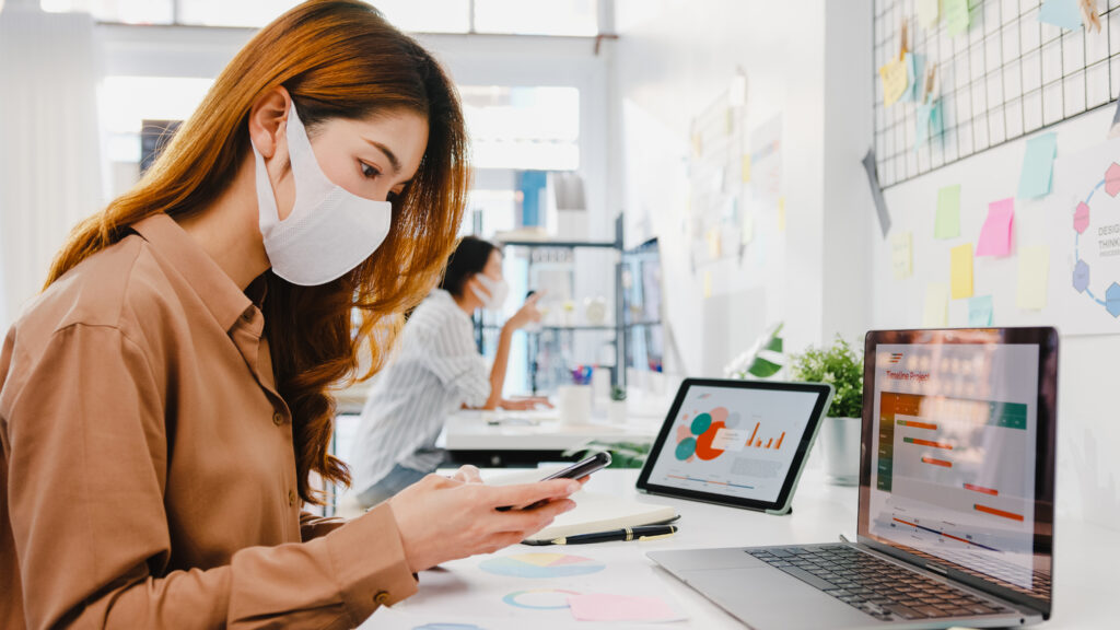 Asia businesswoman entrepreneur wearing face mask for social dis | AD-IOS Web Development Semrush sensor for ad-ios digital marketing agency nicholasville & lexington
