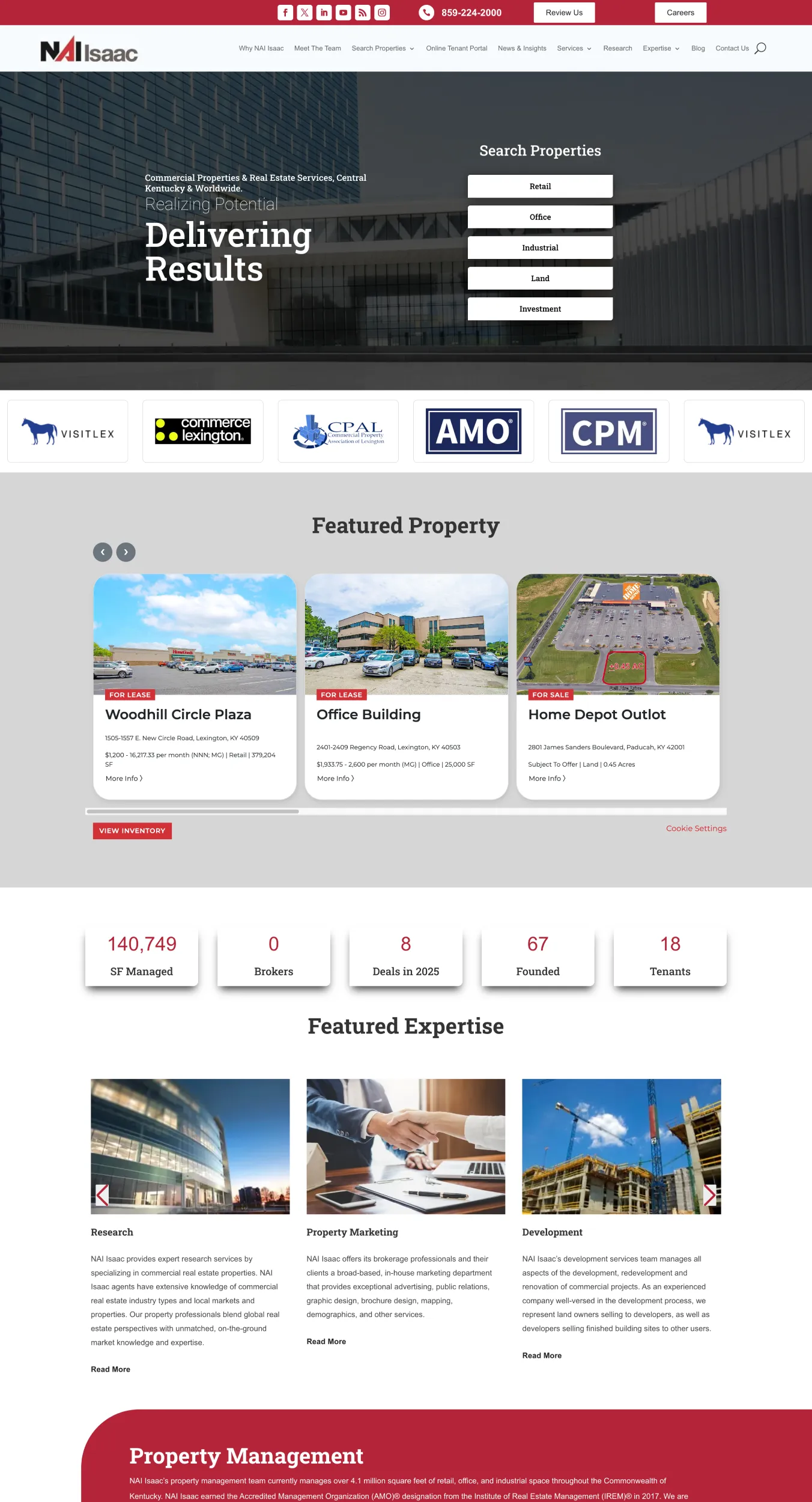Homepage hero: NAI Isaac branding with a dark office building background and a right-side "Search Properties" menu (Retail, Office, Industrial, Land, Investment).